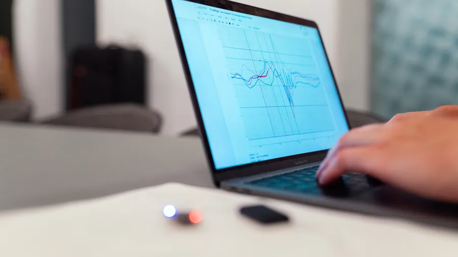 Laptop displaying graphs of data